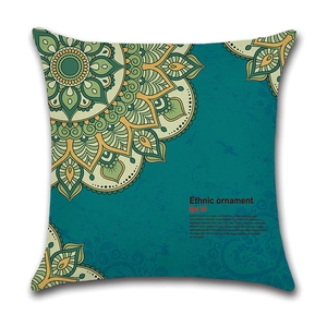 Detail of teal linen pillow cover with mandala ethnic ornament and intricate geometric patterns