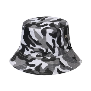 Close-up of black and white camo bucket hat featuring metal eyelets and sport drawcord