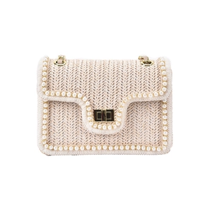 Beige woven straw shoulder bag with pearl trim and golden chain strap for women