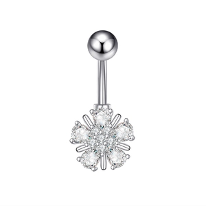 Close-up of silver belly button ring featuring a zircon flower dangle with metallic shine