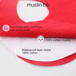 Waterproof red cotton muslin baby bib with breathable double gauze layers and soft lining