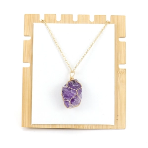 Handmade raw purple amethyst crystal necklace wrapped in gold wire with gold chain