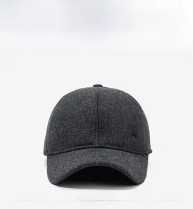 Detailed close-up of dark grey wool baseball cap showing premium fabric texture and R logo