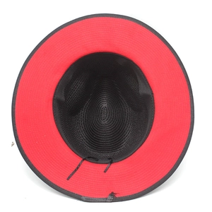 Close-up of the vintage Panama straw hat interior with adjustable strap and red brim