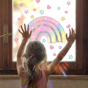 Rainbow holographic window film with heart and star shapes creating prism suncatchers