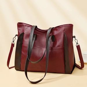 Large burgundy soft leather tote bag for women with dark brown straps and minimalist design