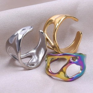 Detailed view of hollow irregular geometric adjustable rings in silver, gold, and rainbow finish