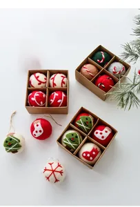 Handmade woolen felt Christmas ball set with snowflakes and trees in a kraft gift box