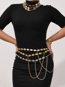 Detail of irregular flat waterdrop link necklace and waist chain in gold and silver