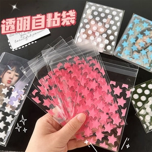Detail view of transparent self-adhesive sleeves with star and dot patterns for photocards