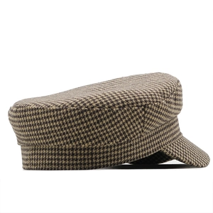 Classic houndstooth newsboy cap in brown and black vintage British style for winter