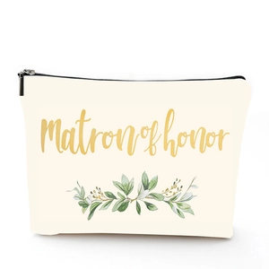 Detail of linen cosmetic bag with Matron of Honor print and green botanical leaves