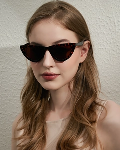 Close-up of stylish vintage tortoiseshell cat-eye sunglasses worn by a female fashion model