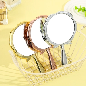 Three elegant rose-shaped handheld makeup mirrors in gold, silver, and rose gold finish