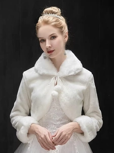 Detailed view of white faux fur bridal shawl with soft texture and plush tie closure