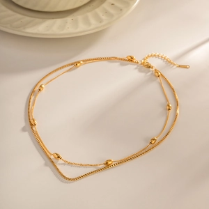 Collier double épaisseur en acier inoxydable plaqué or 18 carats avec perles ovales