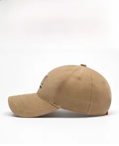 Side view of a khaki cotton baseball cap with curved brim and detailed embroidery detail