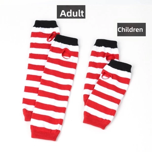 Detail of red and white striped knitted arm warmers and socks in adult and child sizes