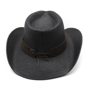 Detail of black woven cowboy hat with brown suede band and decorative bow tie