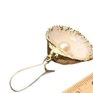 Elegant gold shell drop earrings with cream pearls and sparkling rhinestone trim