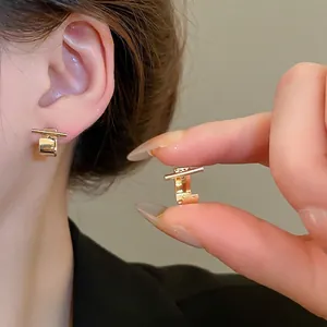 Elegant gold geometric bar stud earrings for women with minimalist polished metal design