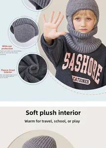 Detail of children's grey knit balaclava showing thick knit texture and warm fleece lining