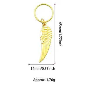 Detailed view of a golden wing pendant with dimensions of 45mm by 14mm for DIY hair decor