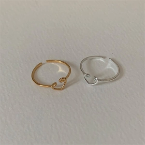 Adjustable 925 sterling silver open ring featuring a minimalist hollow heart design