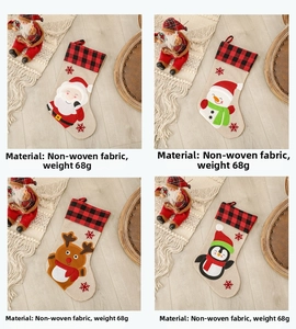 Detailed view of four Christmas stockings with plaid cuffs and cartoon character patterns