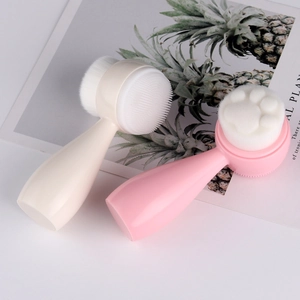 Close-up of dual-sided cat paw facial brushes with soft bristles and silicone massager