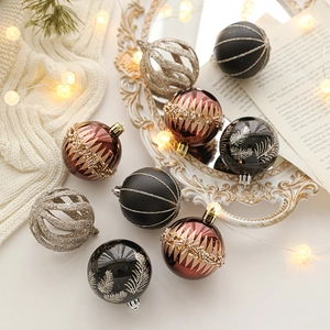 6cm Assorted Christmas ball ornaments in matte black and vintage red on a cozy knit rug