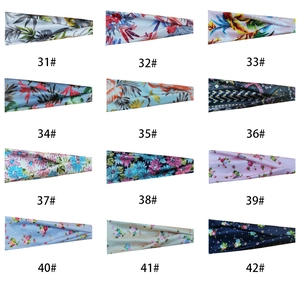 Grid display of 12 printed athletic headbands featuring floral and tropical leaf patterns