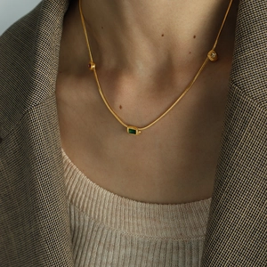 Vintage gold snake chain necklace with emerald green rectangular gemstone pendant