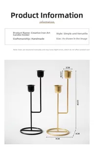 Detailed view of dual-height iron candle holders with measurements in black and matte gold