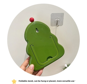 Rear view of green tree-shaped mirror showing U-shaped folding stand and wall hanging hole