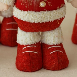 Creative retractable Christmas plush dolls featuring Santa, Snowman, and Reindeer decor