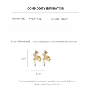 Size chart showing dimensions 7.6cm x 3.1cm for golden koi fish dangle earrings