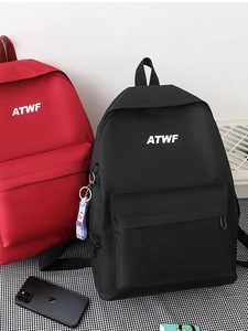 Minimalist red and black school backpacks for men and women in a casual scene