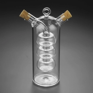 Modern dual-chamber glass oil and vinegar dispenser with cork stoppers and inner sphere design
