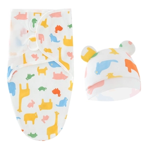 Detailed view of white baby sleep sack and hat with colorful animal prints and cute ears