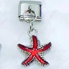 Italian modular charm link featuring a red enamel starfish pendant on stainless steel