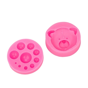Pink silicone mold set featuring teddy bear head and bead designs for cake decorating