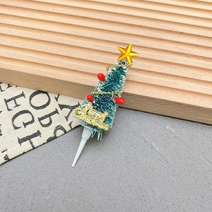 Miniature Christmas tree cake topper with Merry Christmas sign and golden star topper