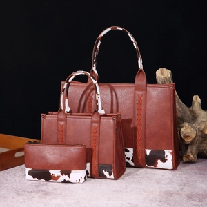Three-piece brown PU leather tote set with black and white cow print texture details