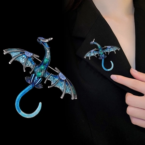 Mythical dragon brooch in deep blue enamel with purple crystals on black suit