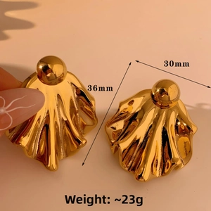Detailed view of gold geometric wave earrings with dimensions of 36mm by 30mm