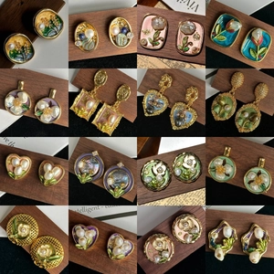 Detailed grid view of sixteen vintage floral enamel earrings in golden metal frames