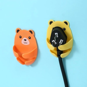 Cartoon bear adhesive power plug hooks for wall storage in orange and yellow colors