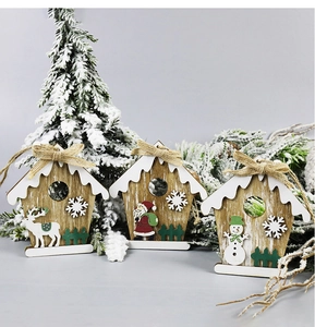 Detailed view of wooden Christmas ornaments featuring Santa, reindeer and snowman designs