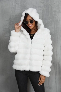 Close-up of white faux fur texture and silver zipper on the hooded jacket